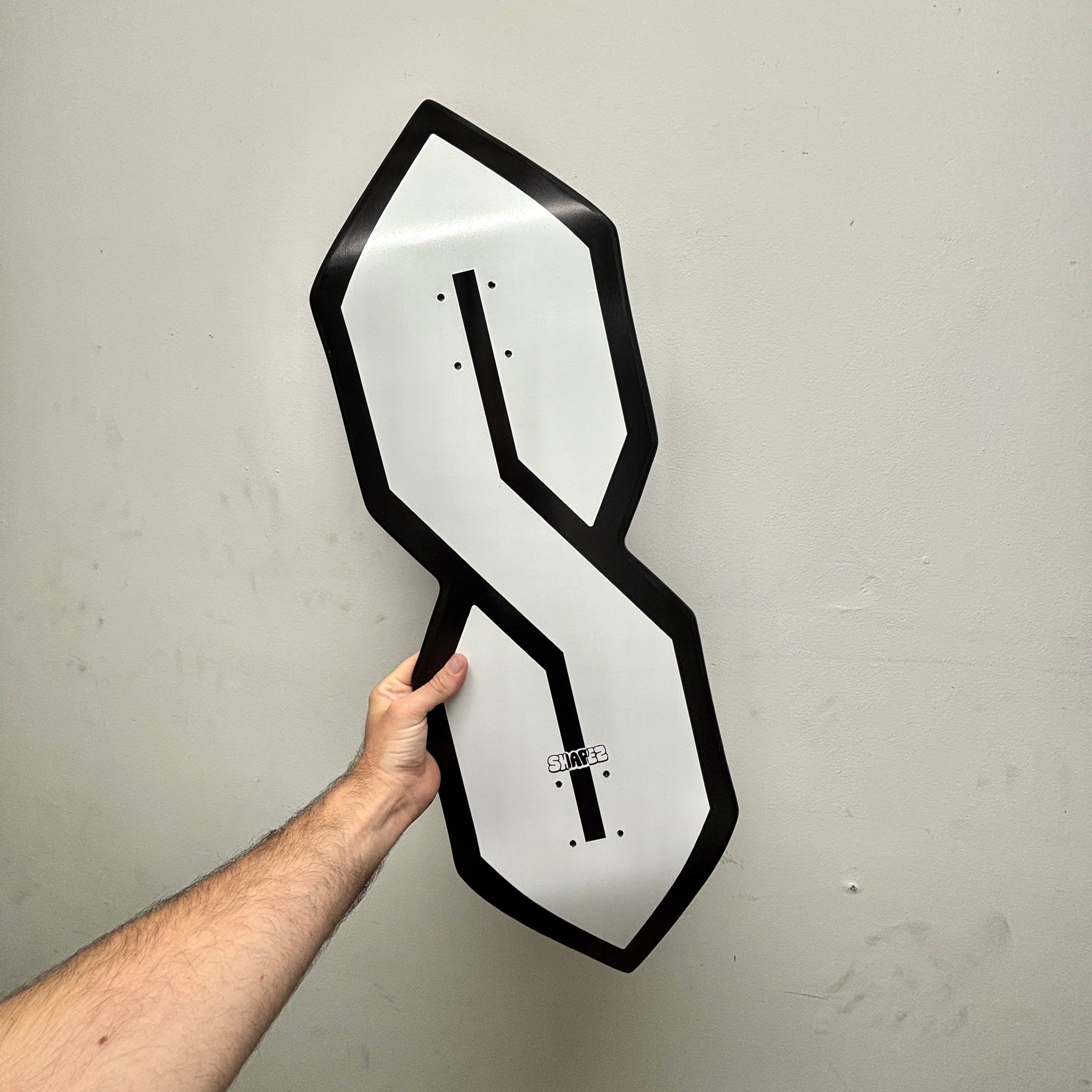 S shaped skateboard deck black outline