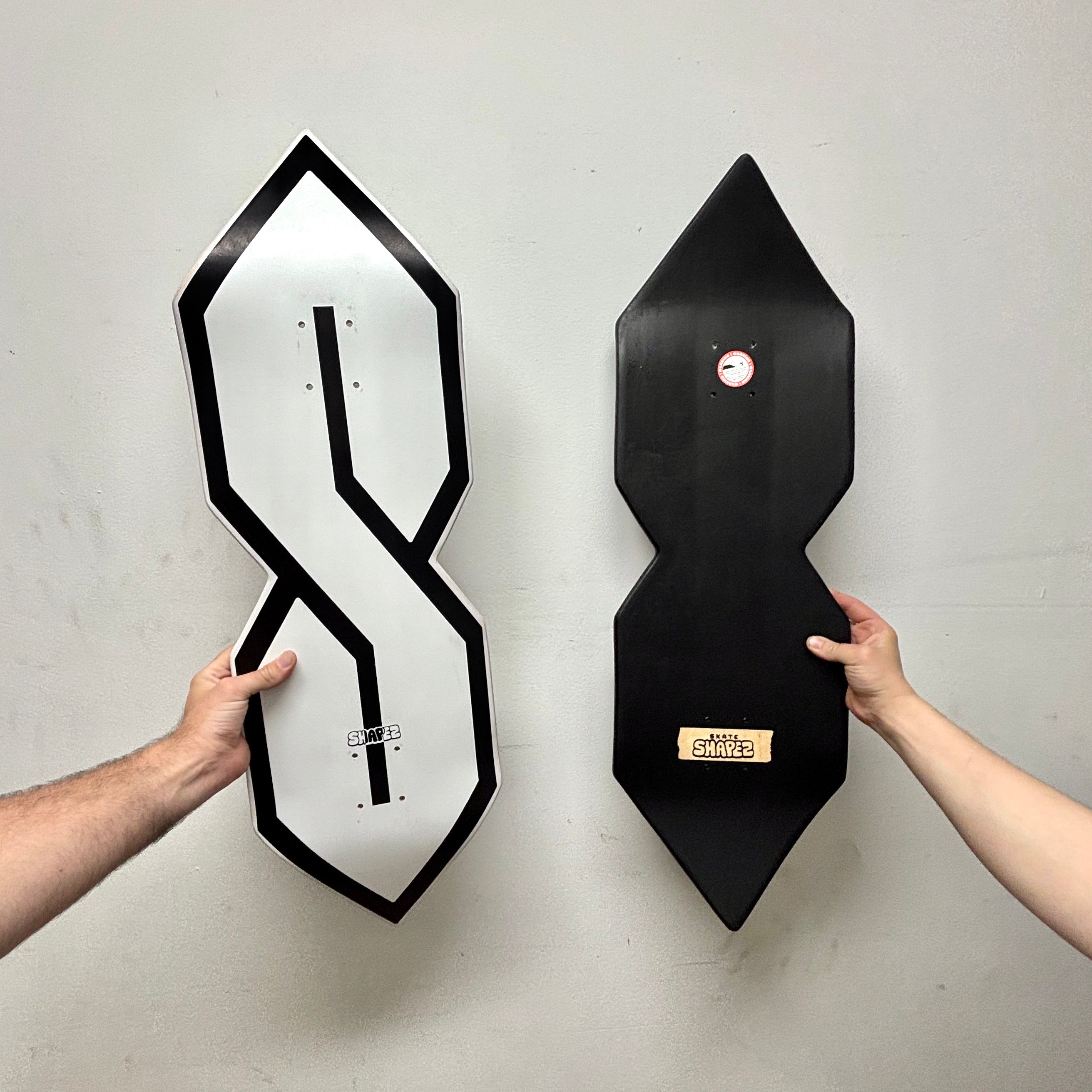 S shaped skateboard deck front and back
